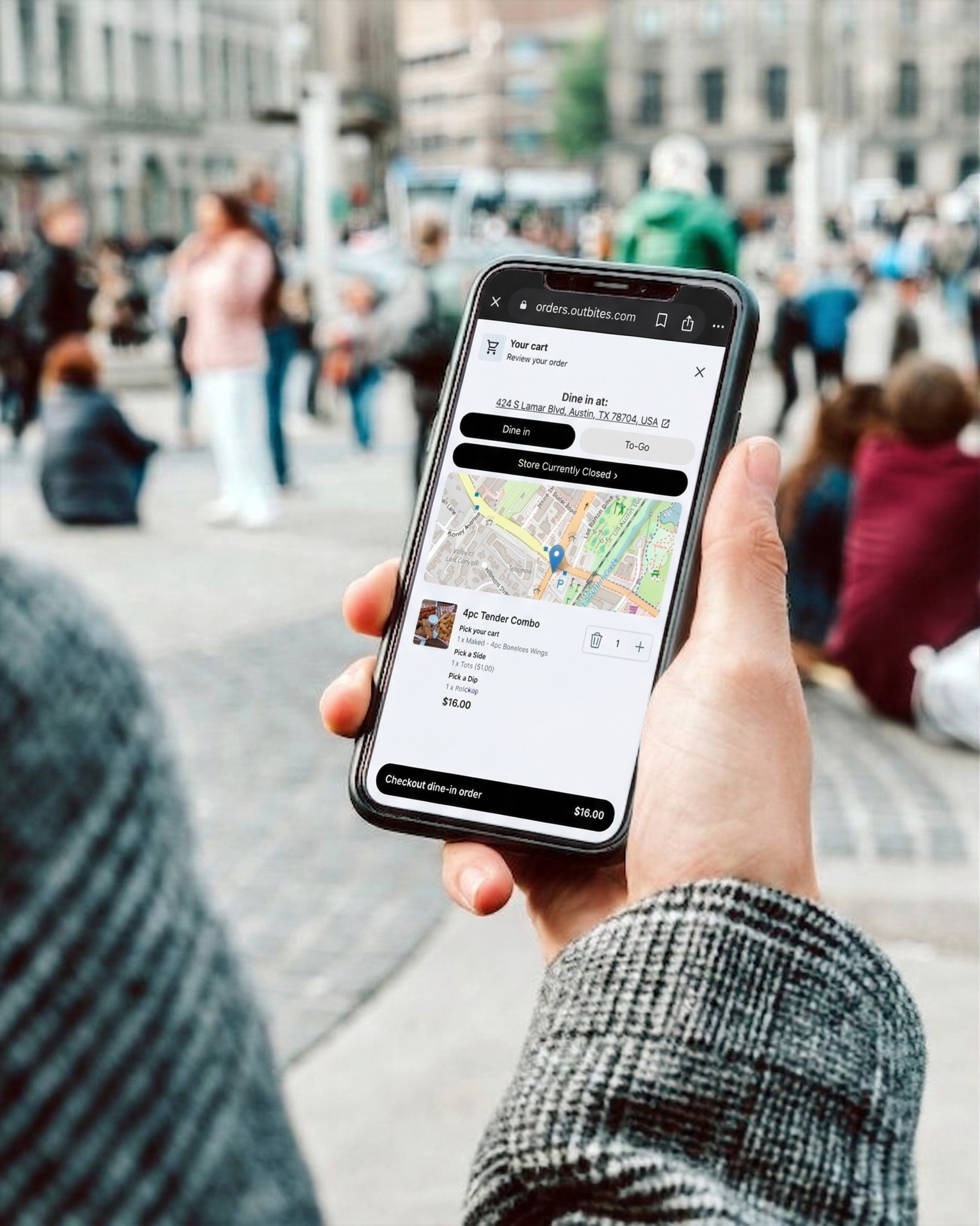 Mobile phone showing Outbites cart review and checkout while ordering food on the go